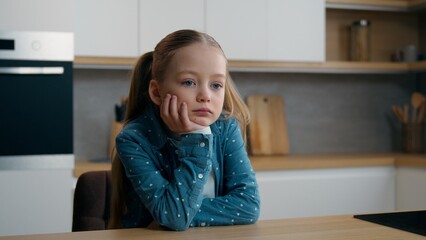 Sad upset pensive thoughtful little offended Caucasian child girl orphan unhappy bad mood lonely...