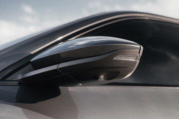 Premium electric SUV in gray with black chrome trim and large wheels.