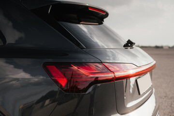 Premium electric SUV in gray with black chrome trim and large wheels.