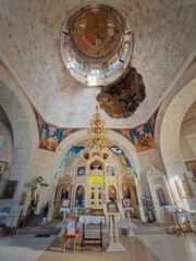 CONDRITA, CHISINAU, MOLDOVA - OCTOBER 21, 2024Condrita Monastery of St Nicholas indoors view of church altar, ornate walls with painted icons and a golden chandelier. Christian Orthodox traditional