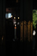lighting candle in a Japanese temple