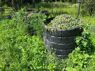Sustainable composting using plastic modular bins and organic waste. Compost containers with dry...