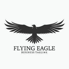 Obraz premium Majestic black eagle soars with outstretched wings across the canvas, embodying freedom and power