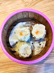 Delicious Steamed Shumai Dumplings in Bamboo Basket