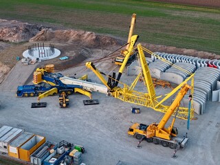Construction of a large crane for the construction of a wind turbine tower, aerial photograph,...