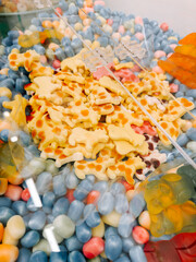 Colorful assortment of candy shapes in a bright display at a sweet shop