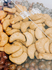 Freshly baked pastries displayed in a clear container at a local bakery in the afternoon