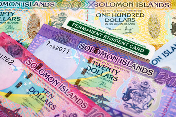 Naklejka premium American Permanent Resident Card on Solomon Islands dollar