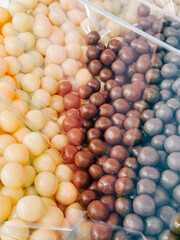 Colorful assortment of chocolate covered candies in various flavors and sizes