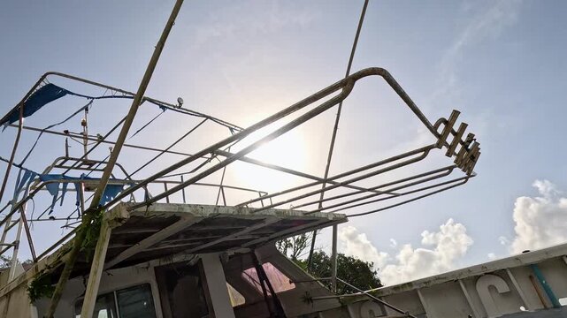Abandoned Fishing Boat Beached Under Bright Sunny Sky