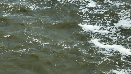 Bird's eye view from a drone capturing treated wastewater passing through the Water Transfer Bridge, moving swiftly to the sea for controlled discharge and flood prevention in urban areas.
