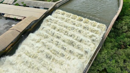 Bird's eye view of the Water Transfer Bridge in Thailand, featuring a flume and pumping station that accelerate water drainage over canals and roads to the sea, helping to reduce flood risk.
