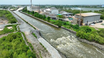Bird's eye view showing the Water Transfer Bridge speeding water discharge to the sea, an essential infrastructure project designed to manage water flow and reduce flood risks effectively.
