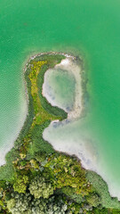 Drone shot of a face looking landscape on a lake in France