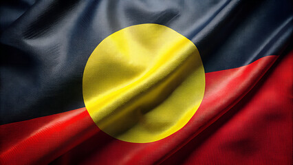 Close up of the australian aboriginal flag waving with rich texture and vibrant colors representing indigenous culture and heritage
