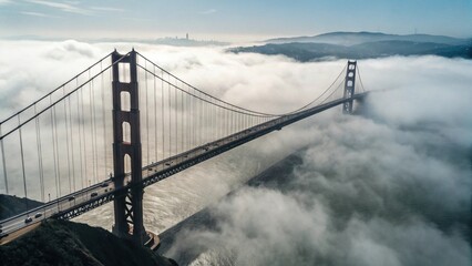 Fototapeta premium Aerial View of the Golden Gate Bridge Emerging from the Fog