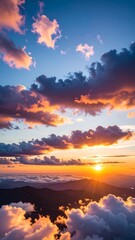 Obraz premium Sunrise over mountain cloudscape