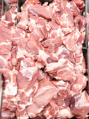Fresh Pork Neck Cuts in Metal Tray at Market.