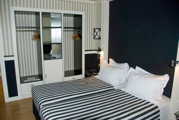 Modern Bedroom Interior with Black and White Striped Pattern Bedding
