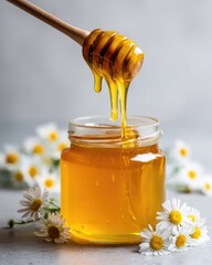 Honey dripping from dipper into jar, surrounded by daisies