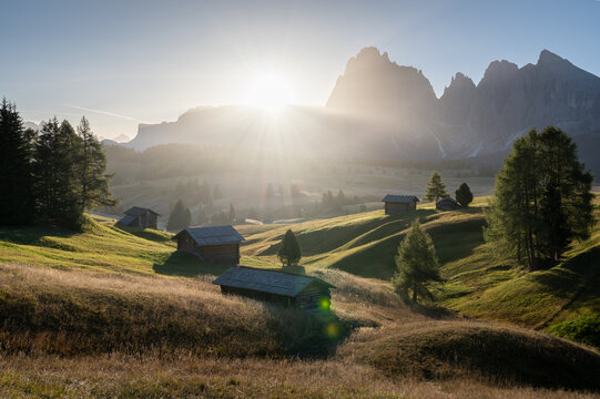 Beautiful sunrise view of meadow Seiser Alm Alpe di Siusi . Morning autumn scenery in Dolomite Alps, South Tyrol, Italy.