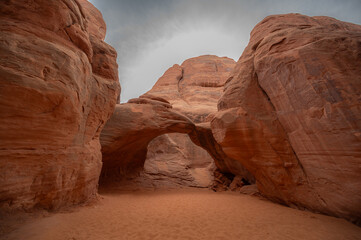 The famous Sand Dune Arch on a moody day in the Arches National Park, Utah 