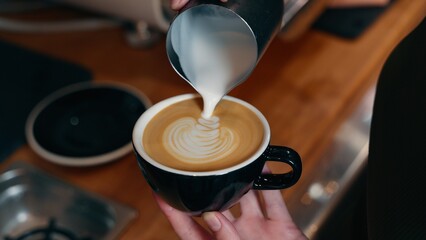 Smiling cheerful Caucasian male small business owner man cafe barista in uniform holding cappuccino...