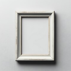 Fototapeta premium Ornate white vintage picture frame hung on a gray wall
