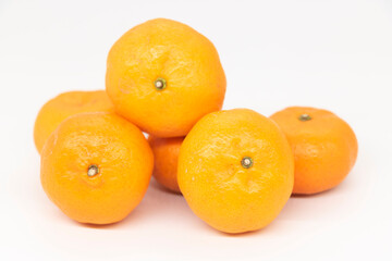 Fresh Citrus or tangerina and peeled fruit on white background.