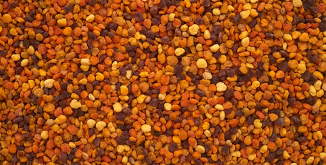 bee pollen granules macro background closeup