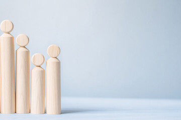 A dynamic composition of wooden people illustrating the career growth and success of the team