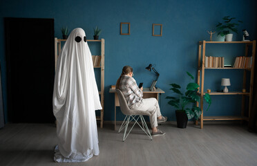 Life and death. afterlife and memory for lost love. woman sitting on chair using smartphone with...
