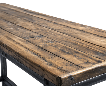 Close-up of a rustic wooden table top, showing the wood grain and metal supports