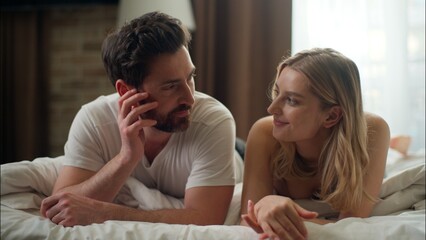 Joyful Caucasian married couple partners relaxing in bed at home love family woman husband smile...