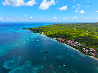 Guadeloupe, Bassa Terra, West Indies. Caribs. Lesser Antilles. Atlantic Ocean. Incredible colors and views. Ocean view. Drone view. View from above. Boats and yachts. High resolution photo. 