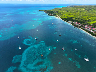 Guadeloupe, Bassa Terra, West Indies. Caribs. Lesser Antilles. Atlantic Ocean. Incredible colors and views. Ocean view. Drone view. View from above. Boats and yachts. High resolution photo. 
