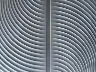 Close up of blue 3D curved panel with grouts trimming. 3D curvy and arched pattern wall panel in...