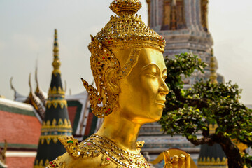 Golden statue of Kinnari inside Wat Phra Kaew Grand Palace, Bangkok, Thailand