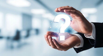 Man holding a glowing question mark symbol in his hands. Concept of solution search, common question, or frequently asked question.