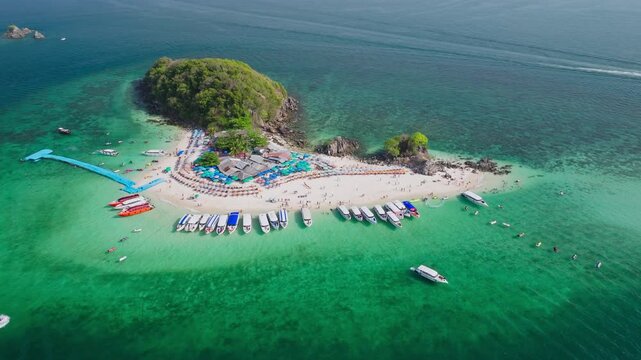 Aerial view of Koh Khai Nok island, a vibrant scene with boats, people, and turquoise waters creating a picturesque coastal paradise, Phru Nai, Phang Nga, Thailand.