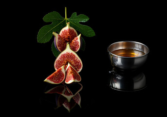 Figs and Honey Reflect on Dark Gleaming Surface