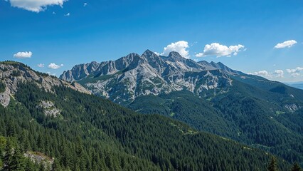 Fototapeta premium Expansive rugged peaks stretch under a bright azure sky, showcasing lush greenery on the hillsides. The peaceful setting beckons discovery and excitement.