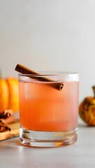 Autumn Spiced Drink with Cinnamon Stick and Pumpkins