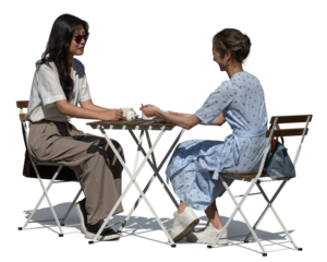 Two Asian women sitting in an outdoor cafe and talking, isolated on transparent and white background