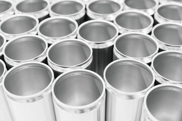 Rows of silver metal canisters in a beer production facility