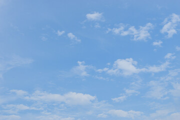 The blue sky is decorated with moving white clouds