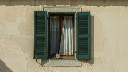 Fototapeta premium Open window framed in blue against white walls with floral accents in a vintage style