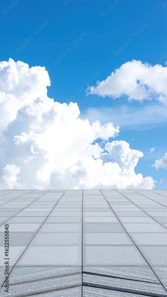 Poster a pristine white building stands tall against a backdrop of fluffy white clouds drifting in a bright