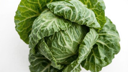 Macro shot of green Chinese cabbage with a white backdrop
