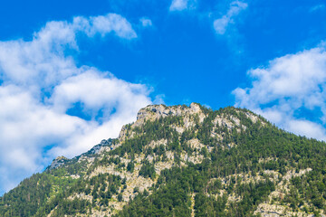 Alpine mountain and hill landscape panorama with cave Salzburg Austria.